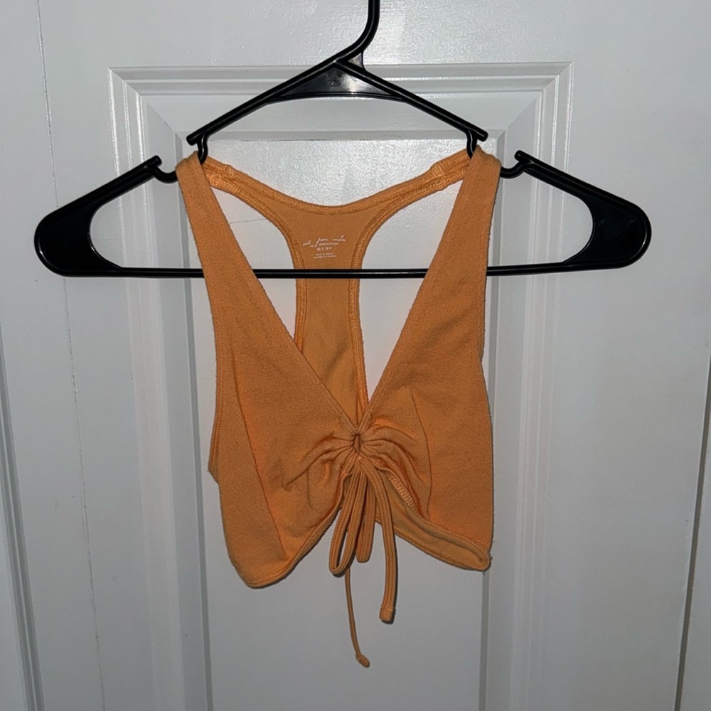 Urban Outfitters out from under tank top